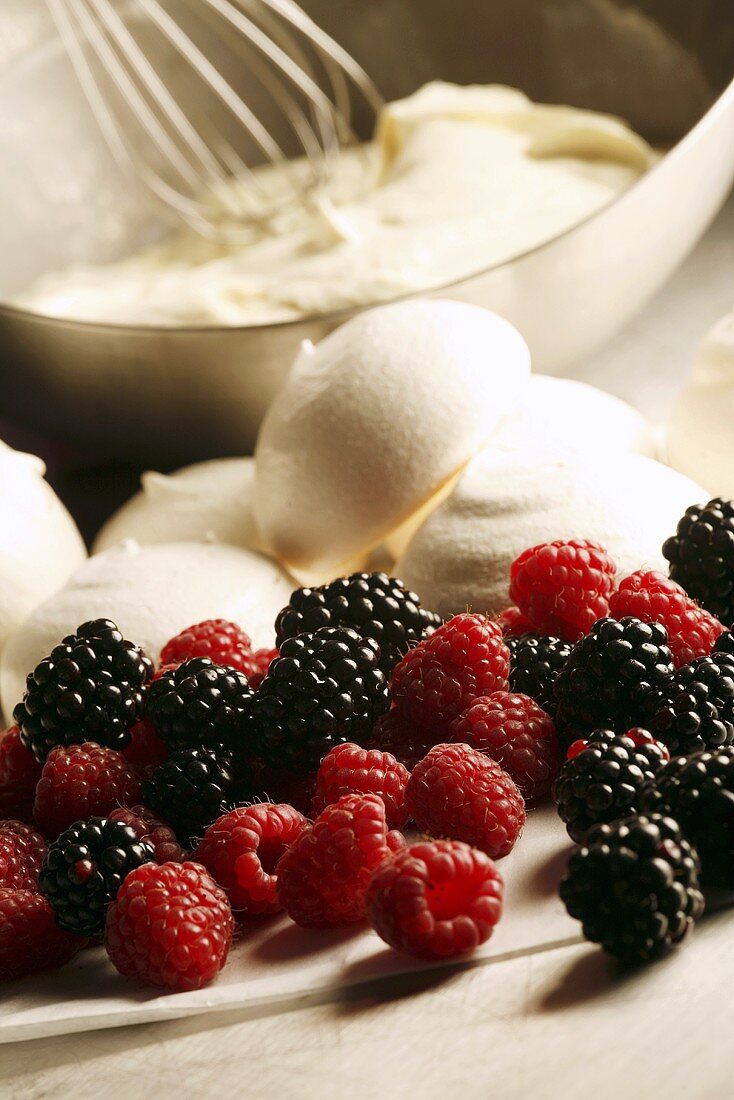 Ingredients for Eton Mess (berries, meringue and cream, England)
