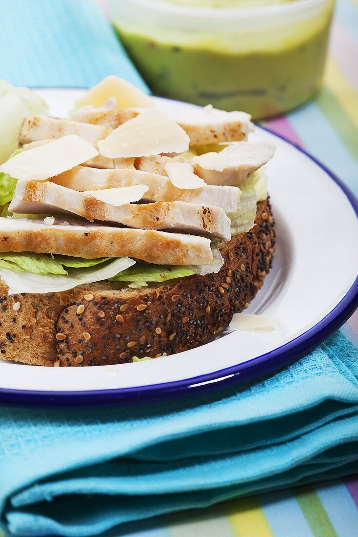 Chicken breast, Parmesan and lettuce on bread
