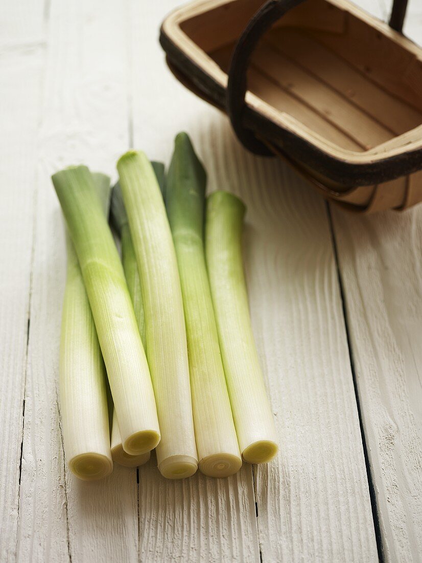 Leeks on wooden table