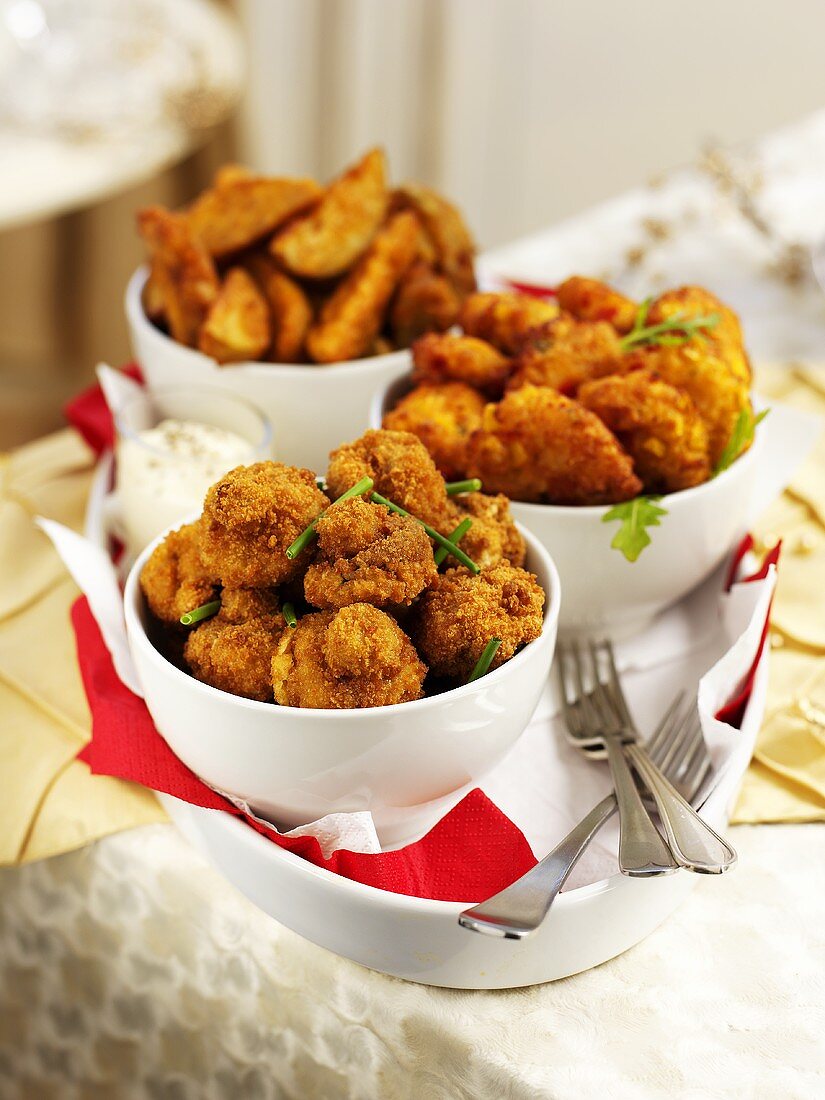 Deep-fried mushrooms and potato wedges for Christmas