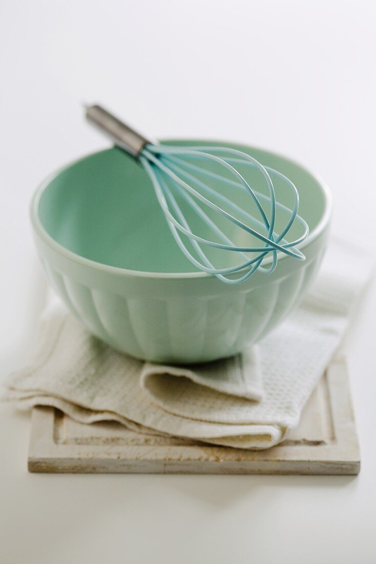 Blue mixing bowl with whisk