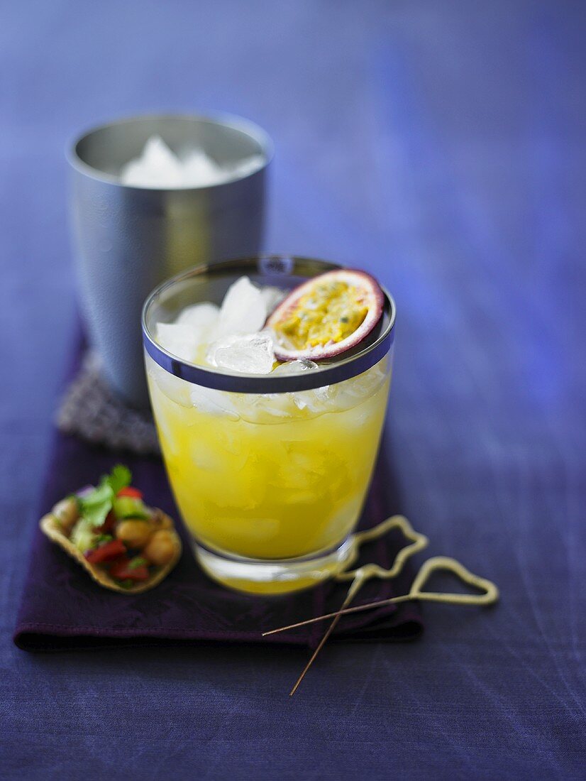 Passion fruit cocktail with ice cubes