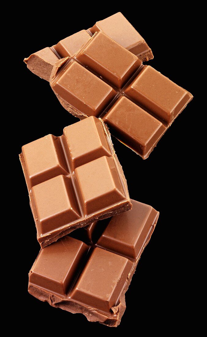 Pieces of chocolate on a black background