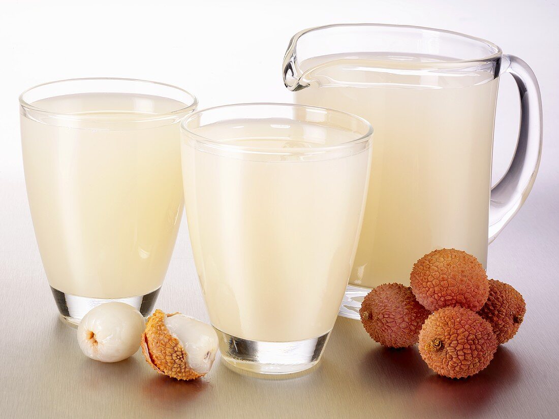 Lychee juice in glasses and a glass jug