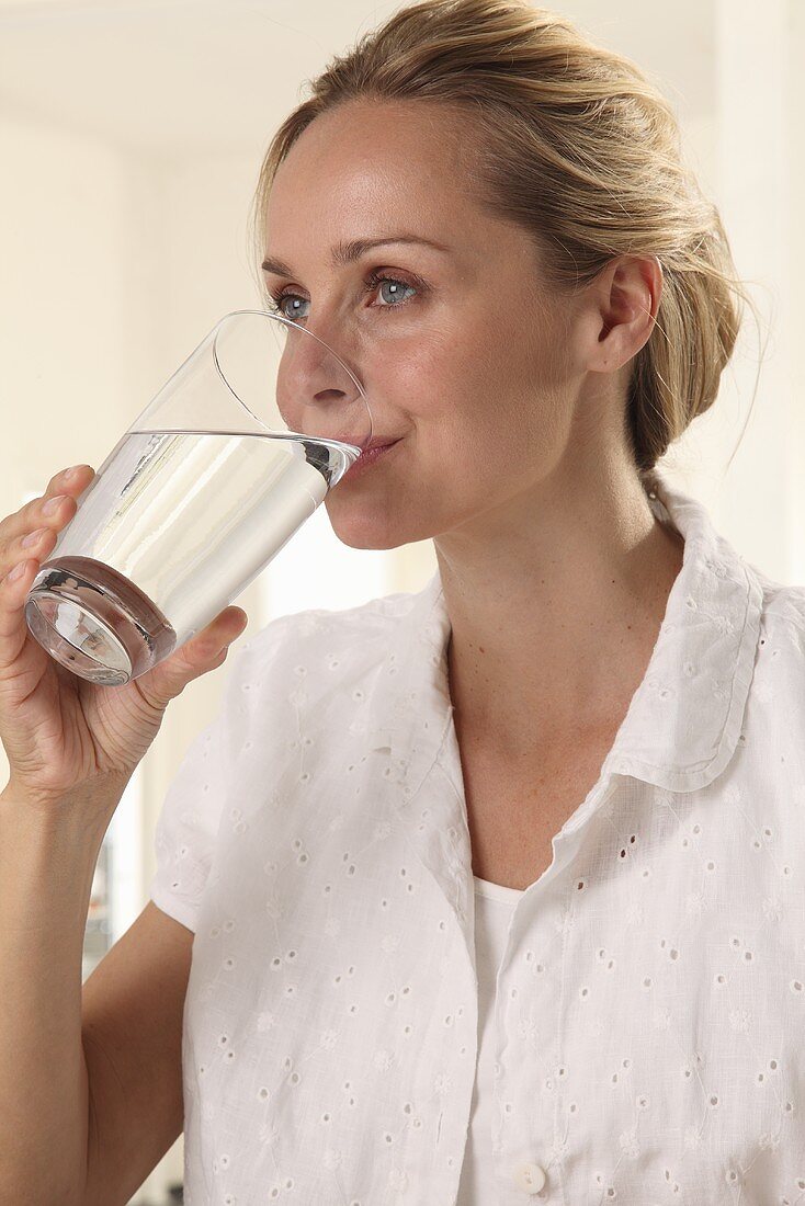 Woman drinking glass of water