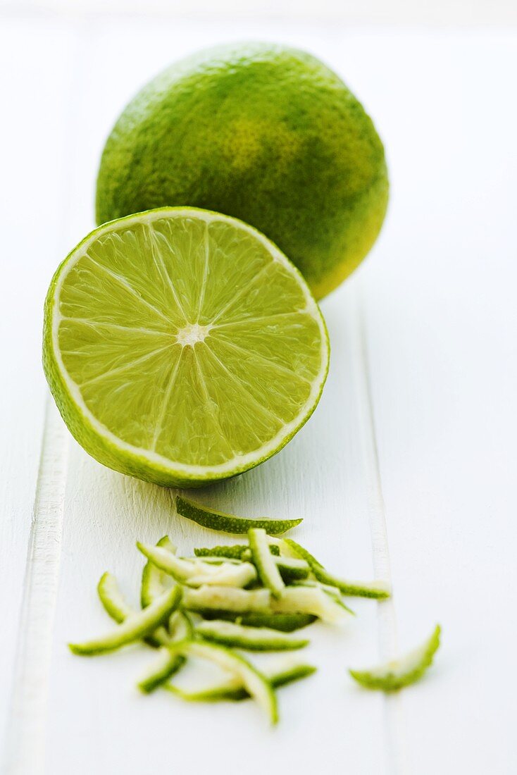 Limes, whole, halved and zest