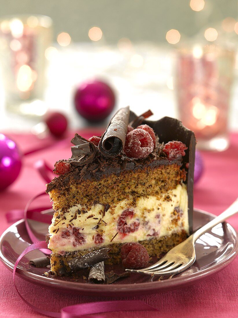 A piece of chocolate cake with raspberries