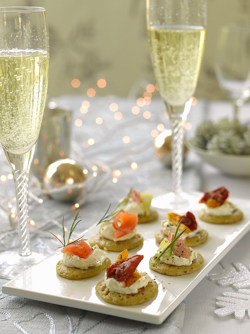 Blinis with various toppings and champagne
