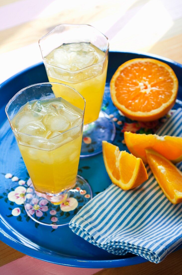 Orange drinks with ice cubes