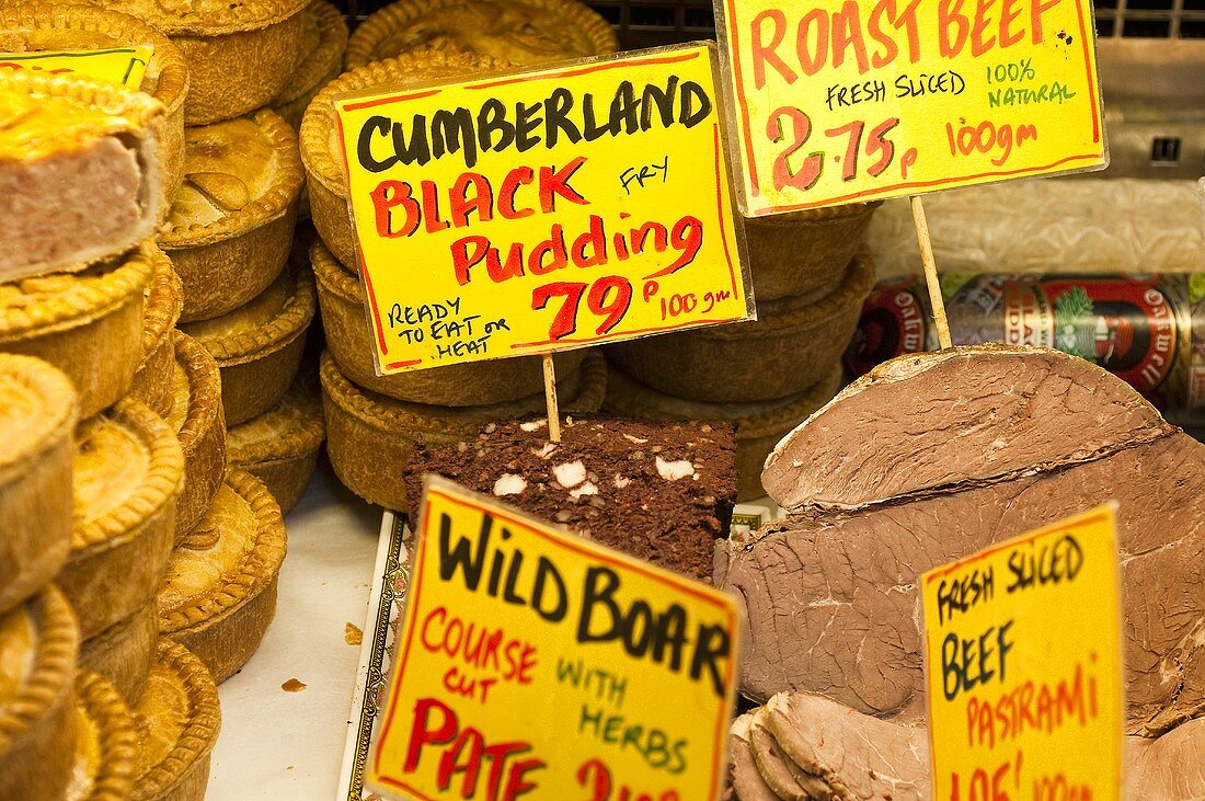 English pies and meat with price labels at a market