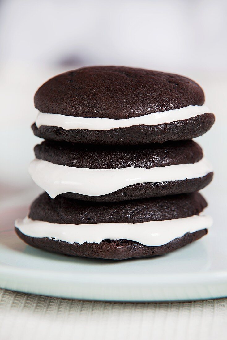 A stack of three chocolate whoopie pies