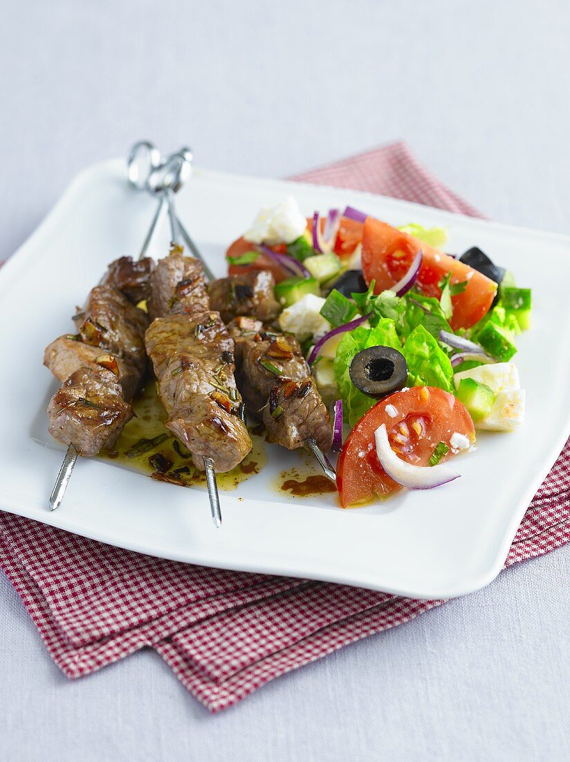 Lamb kebabs with a side salad