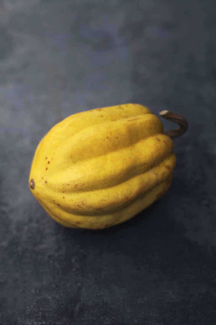 A squash on a grey surface