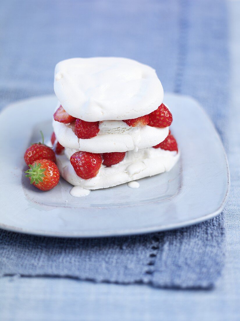 Meringue and cream dessert with strawberries