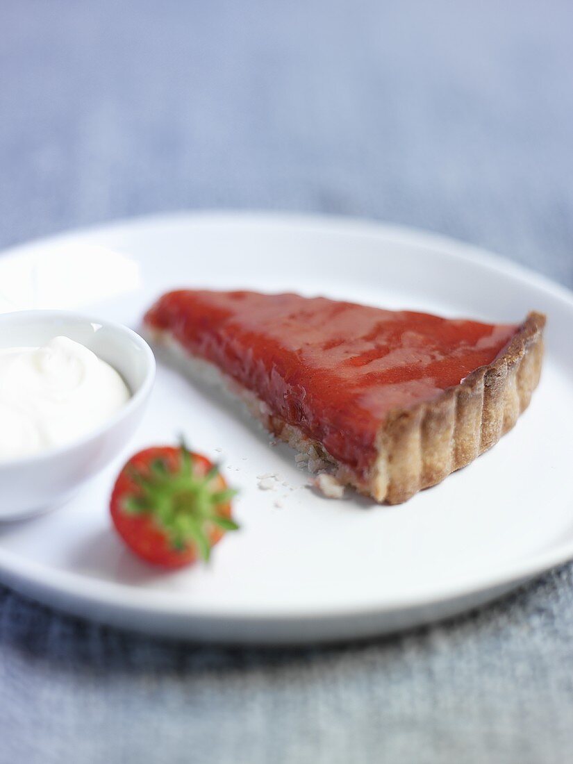 A slice of strawberry, rhubarb and lemon tart