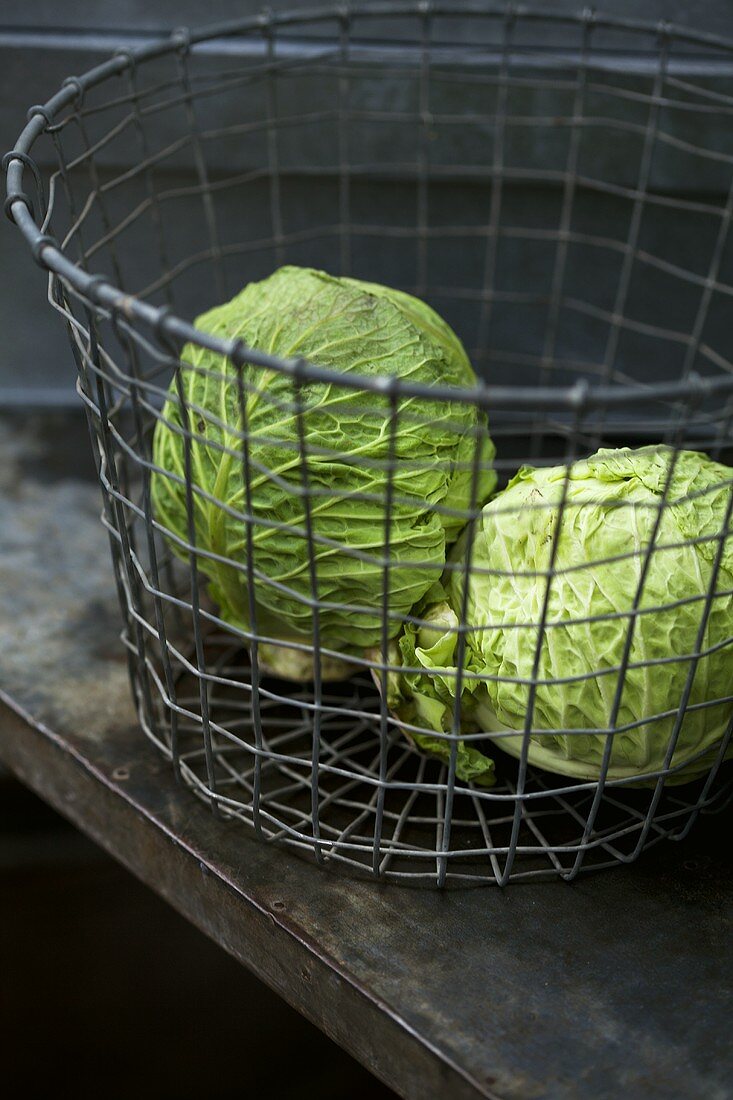 Savoy cabbage in a wire basket