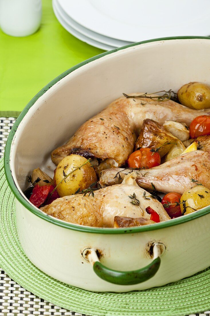 Stewed chicken legs with potatoes and cherry tomatoes