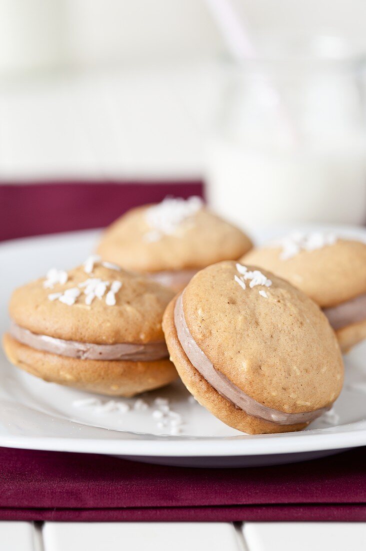 Several Whoopie Pies with grated coconut