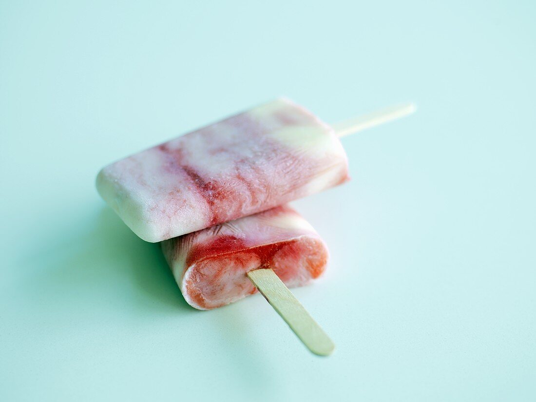 Two popsicles (raspberry-vanilla ice cream)