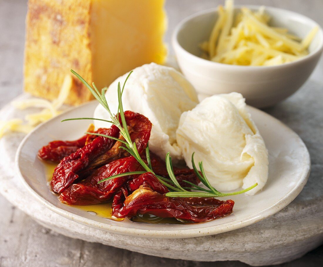 Dried tomatoes and mozzarella on a plate