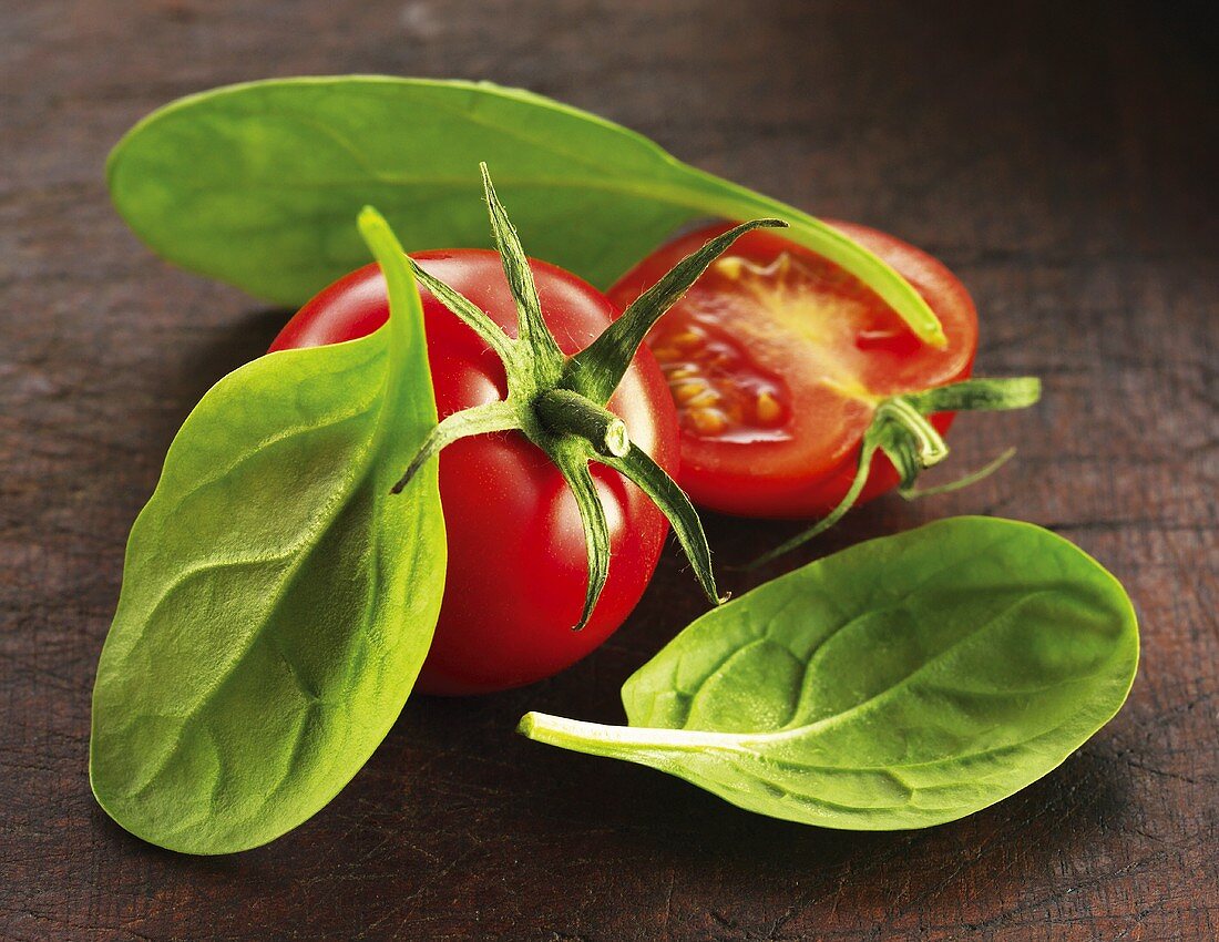 Tomatoes and fresh spinach leaves