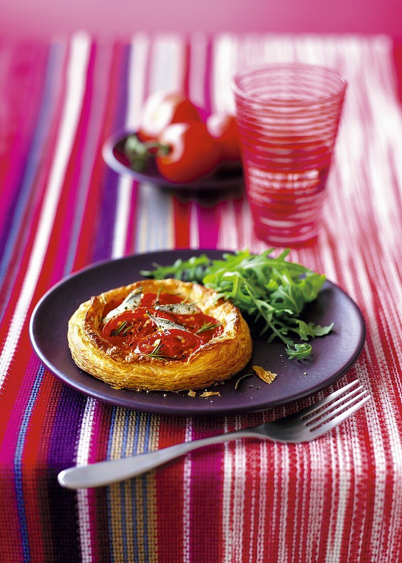 A mini puff pastry tartlet with tomatoes