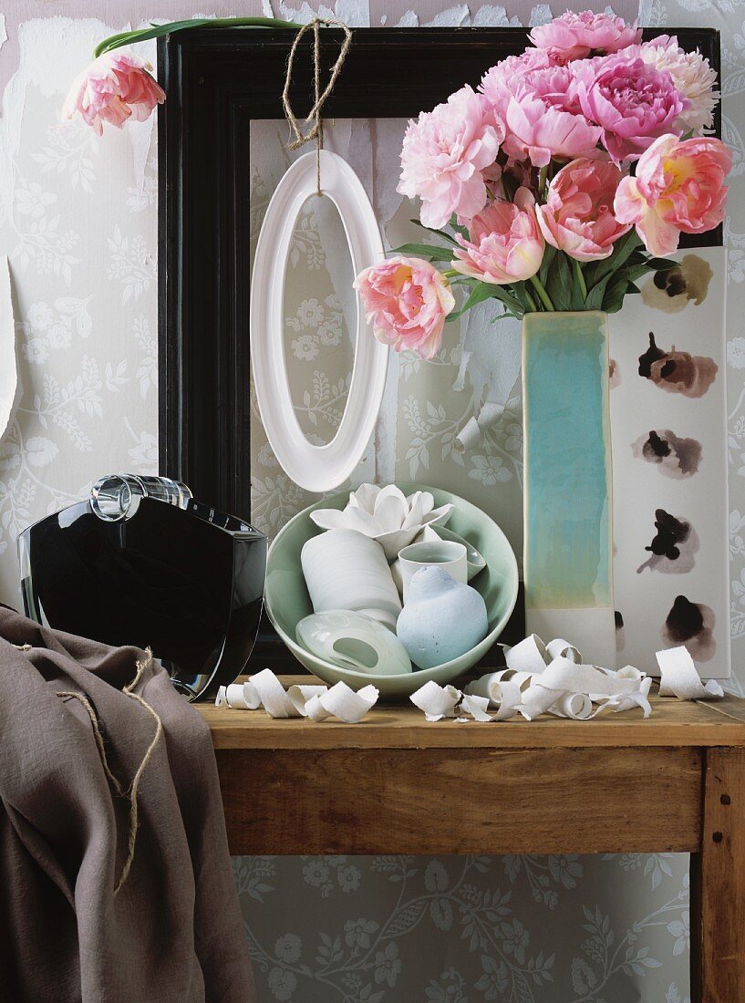 Peonies, white bowl and curls of torn wallpaper