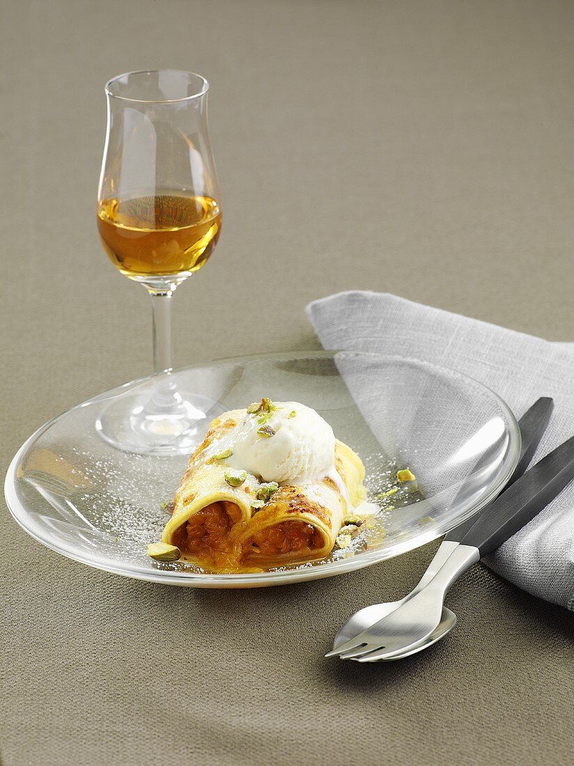 Canneloni with cloudberries and vanilla ice cream