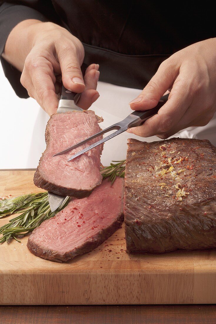 Roast beef being sliced