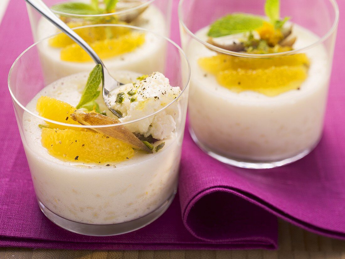 Rice pudding with orange slices and pistachios