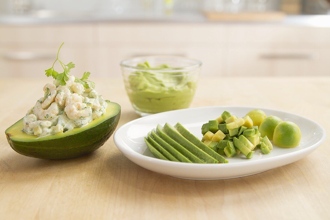 Stuffed avocado, sliced avocado and guacamole