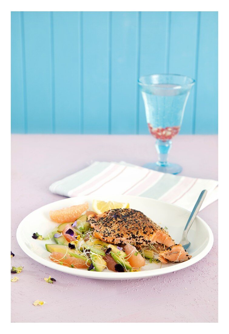 Salmon with a sesame coating with grapefruit, avocado and celery