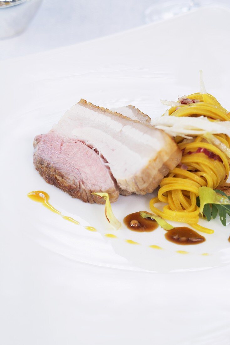 Roast pork belly with tagliatelle salad