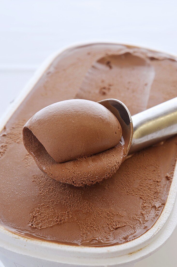 Chocolate ice cream with an ice cream scoop