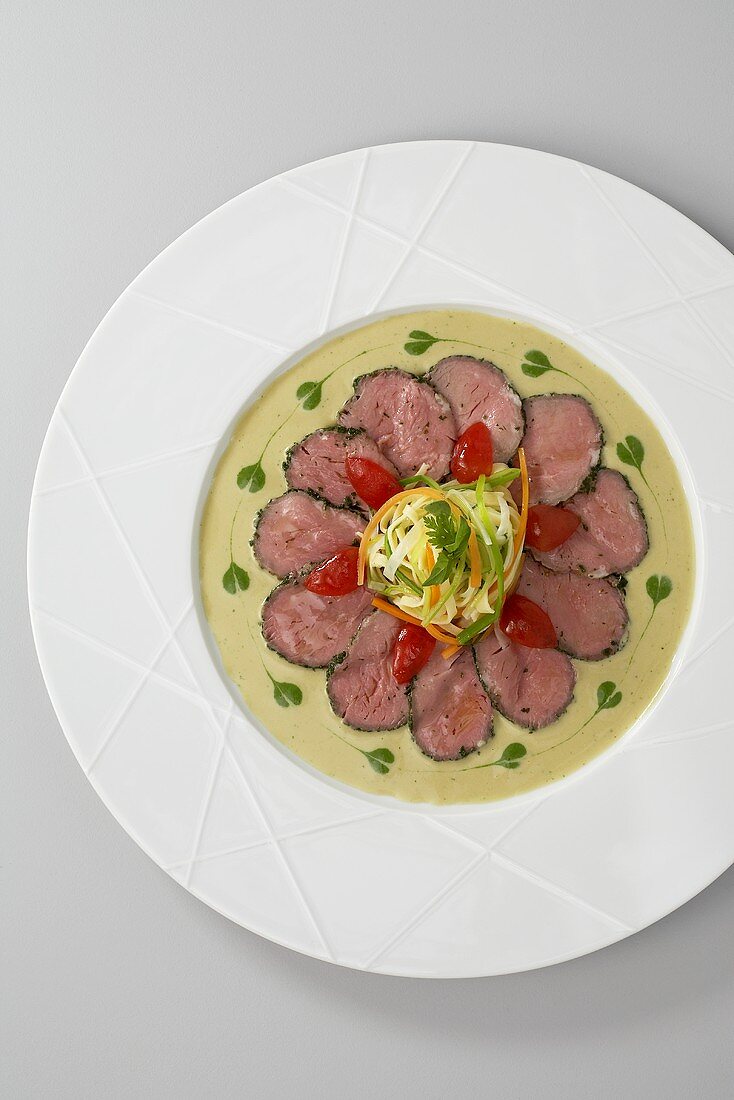 Veal fillet wrapped in herbs with a tuna and basil sauce