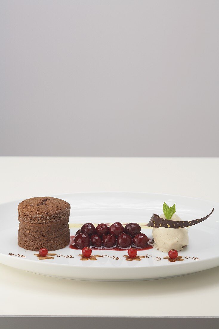 Chocolate pudding with spiced cherries and tonka bean ice cream