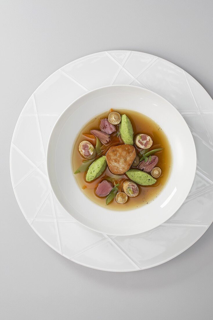 Goose consommé with herb semolina dumplings