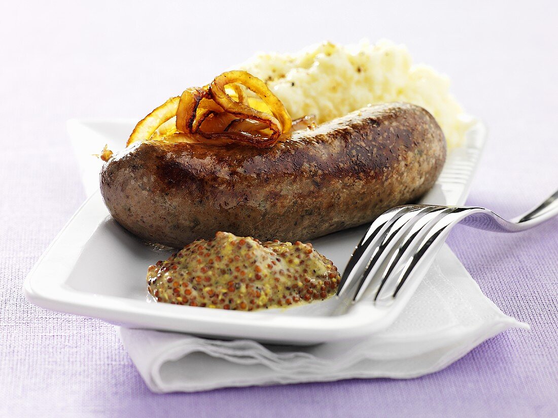 Sausage with mustard, onions and mashed potatoes