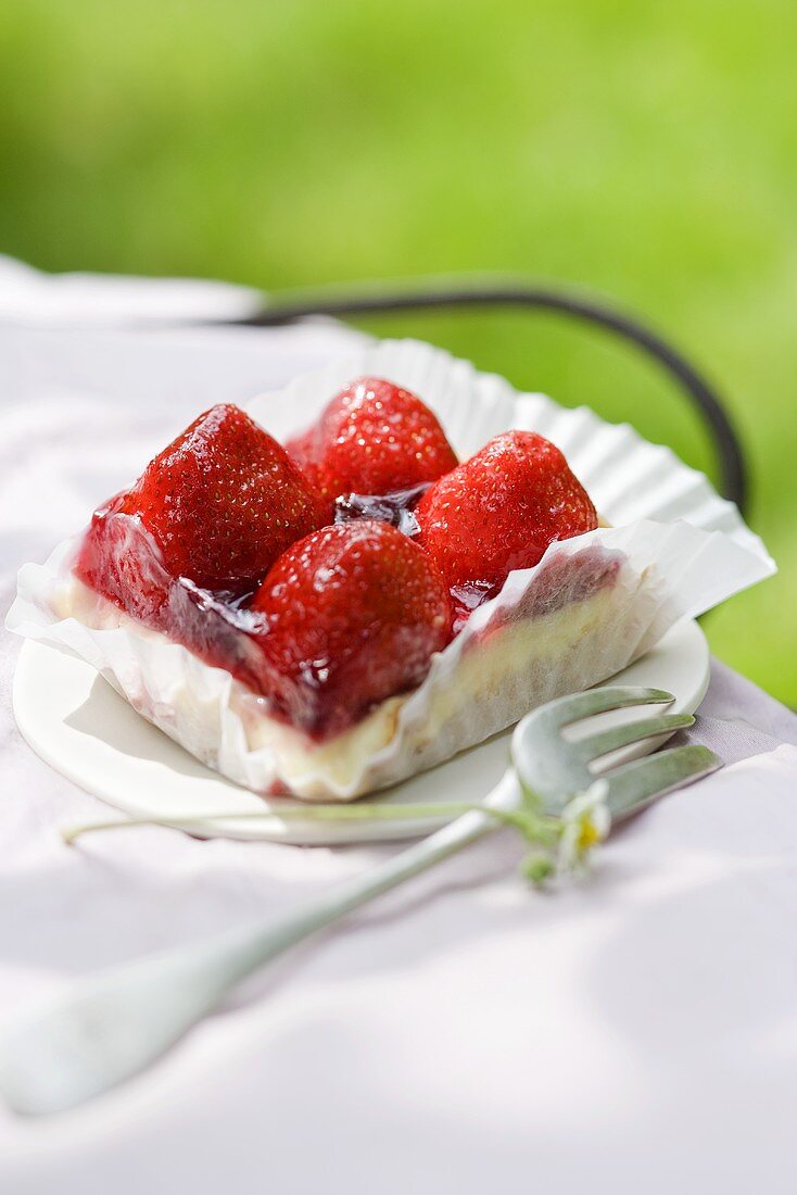 A slice of strawberry and vanilla cake