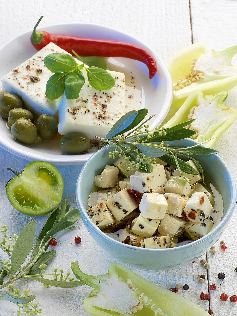 Feta in bowls with olives and pepper