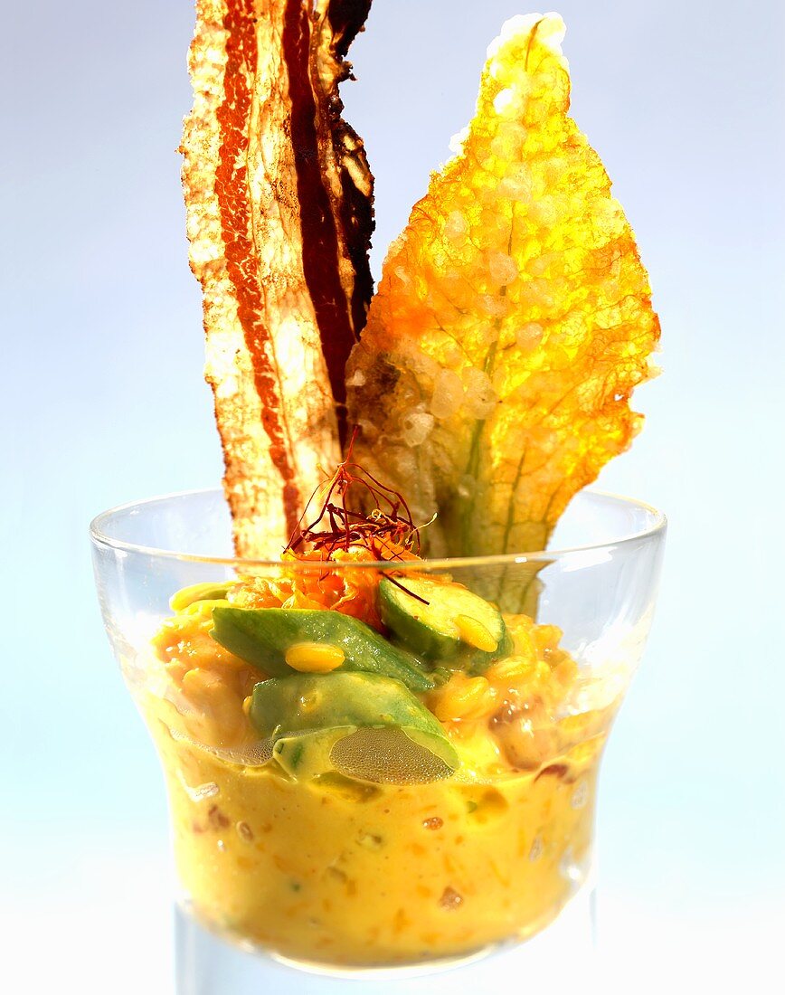 Saffron risotto with courgette flowers and fried bacon