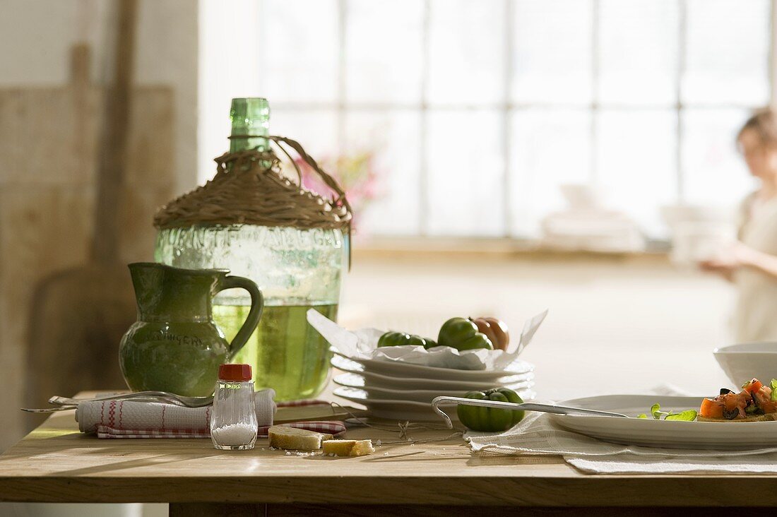 A still life with a large demijohn