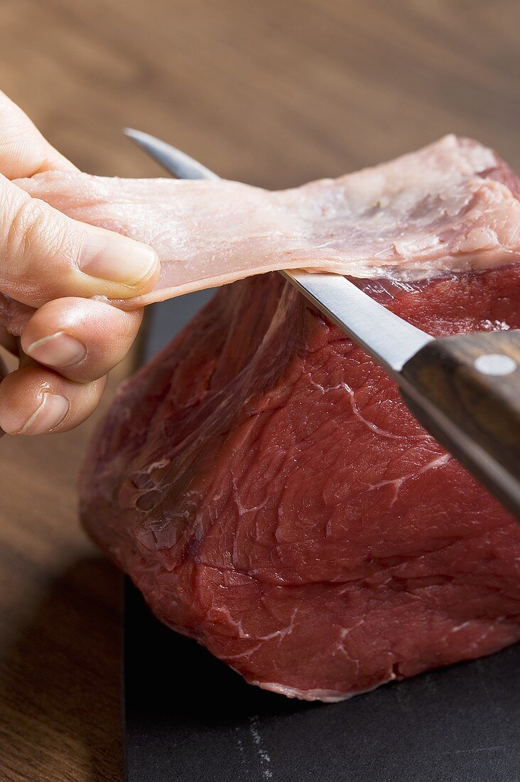 Meat being carved for carpaccio