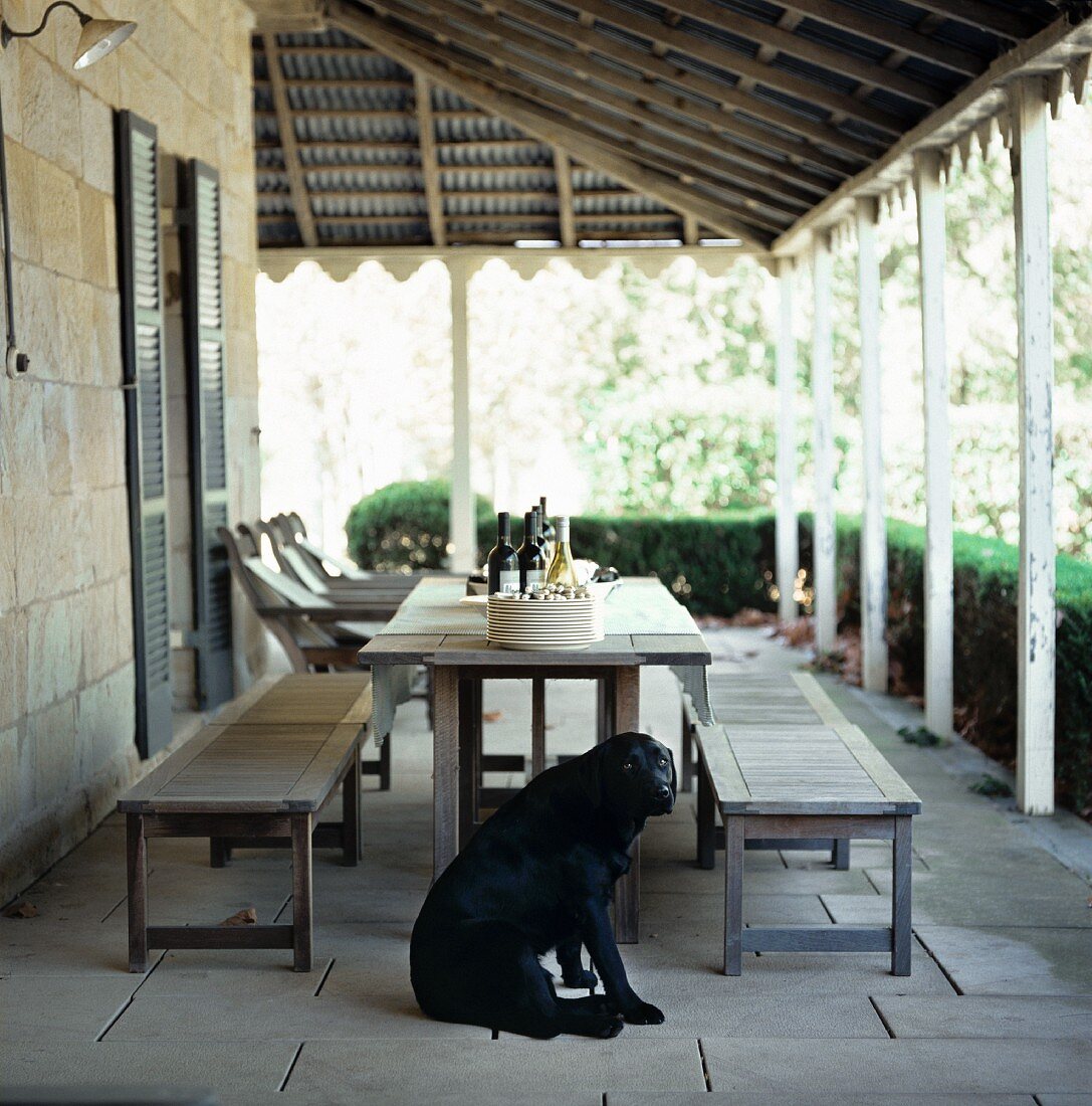 A table laid on the veranda of a country house