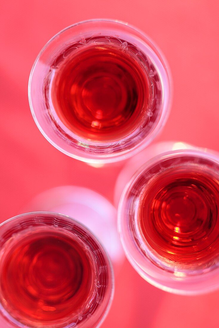 Three glasses of cherry liqueur (seen from above)