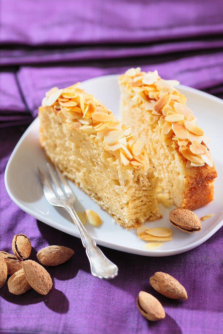 Two slices of yeast dough cake with slivered almonds