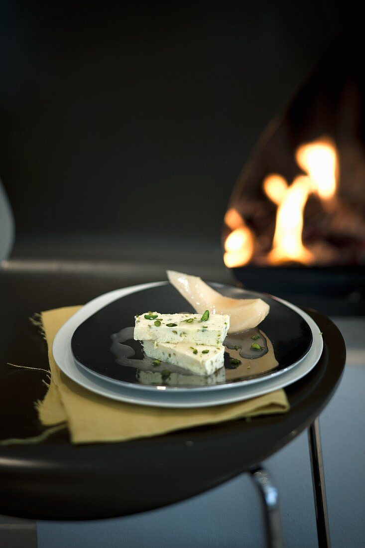 Pistachio parfait with slices of quince