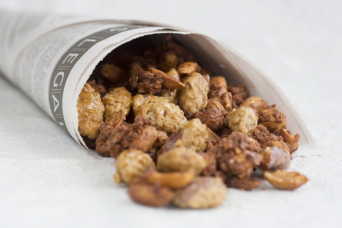 Roasted almonds and peanuts in paper bags