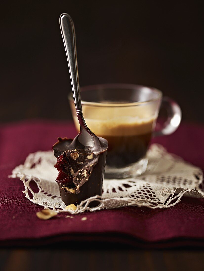 Nut and cranberry chocolate on a spoon