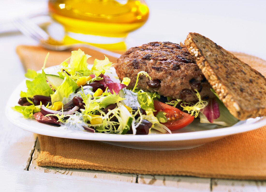Kidney burger with a mixed leaf salad